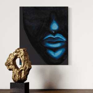 Abstract face artwork with gold sculpture.