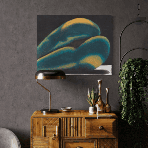 Abstract art above a wooden dresser.